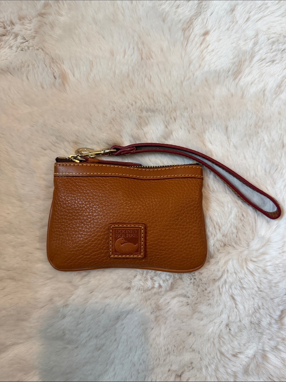 Dooney & Bourke Tan Pebbled Leather Wristlet with Red-Trim Strap